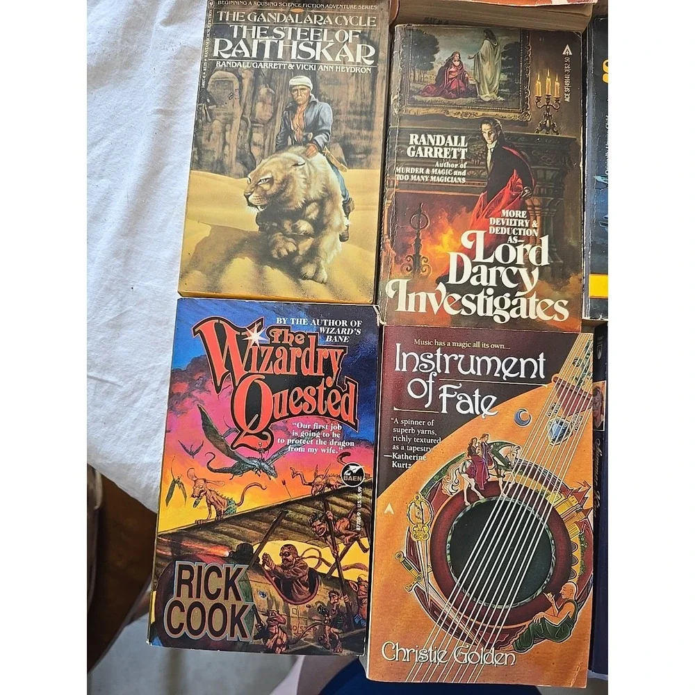 Lot of 9 Randall Garrett, Lisa Goldstein, Rick Cook & Christie Golden PB Books